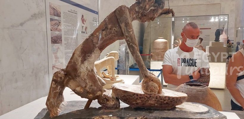 Grinding wheat man statue NMEC Egypt Fun Tours