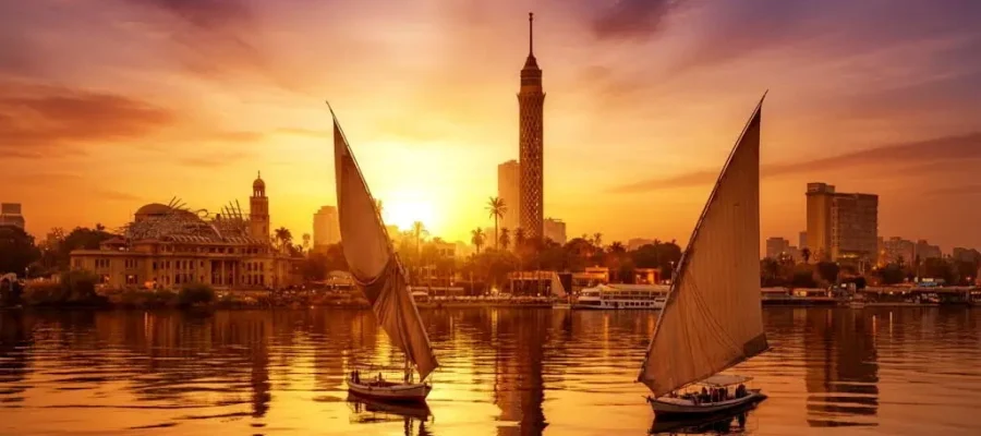 View of the Nile and Cairo tower with Feluccas at Sunset